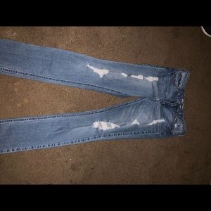 Light blue ripped jeans